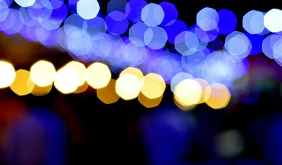 Abstract bokeh photo capturing blue and orange lights